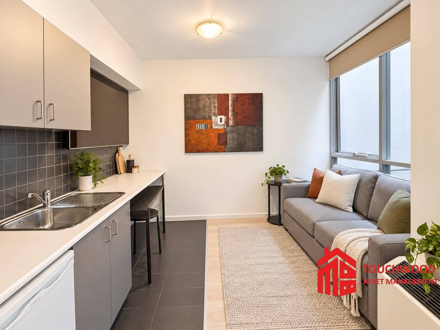 Living area and kitchenette at 2016/39 Lonsdale Street, Melbourne