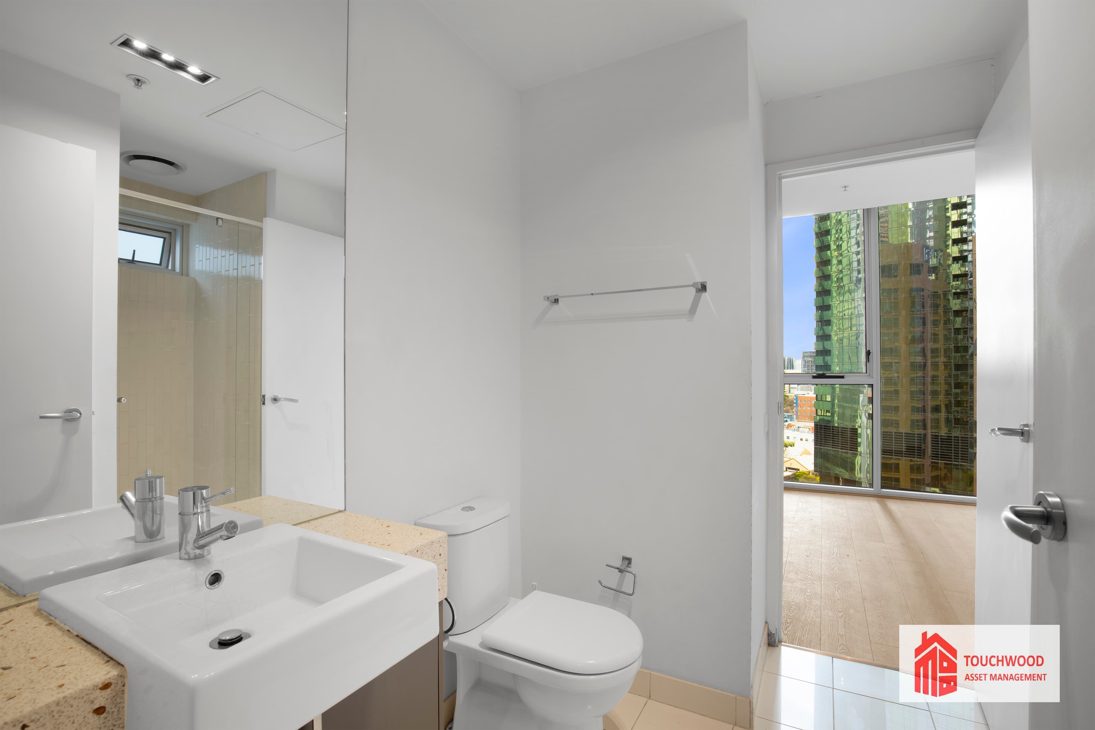 Renovated bathroom with stone finishes